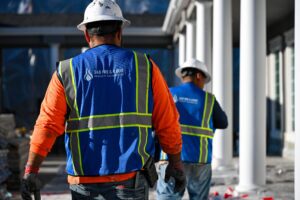 360 Fire & Flood two guys in hard hats rebuilding
