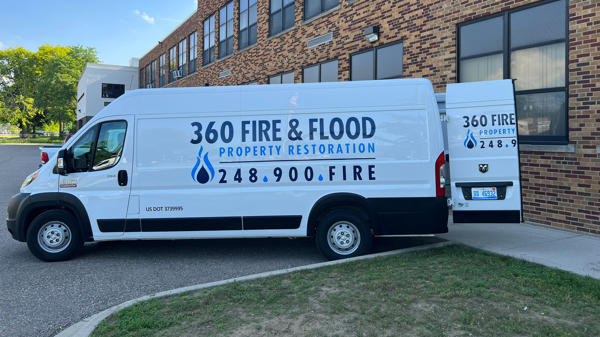360 Fire & Flood truck parked in front of job site